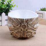 antique human skull planter back view