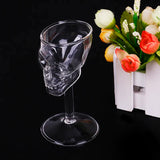 empty skull wine glass and flowers